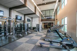 a gym with cardio equipment and tread machines at Rooftop Pool - Golf, Shopping & Dining 2 Miles wtih Parking - 4404 in Scottsdale