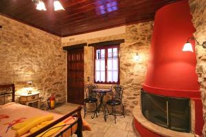 a bedroom with a large red object in a room at Sponsor of the E4 Peloponnese Trail in Daras