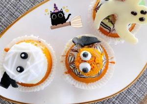 a plate of cupcakes withooky food on it at Flamingo Grand Hotel & Spa in Albena