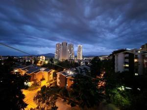 a city skyline at night with tall buildings at Bright, modern - 2 bedroom condo in Skopje