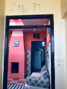 a doll house with a bed in a room at Cap sim surf house in Essaouira
