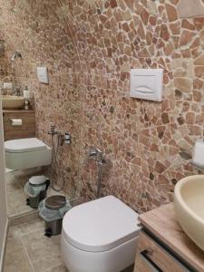 a bathroom with a toilet and a sink at Incanto in Altamura +19 photos
