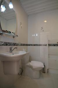 a bathroom with a sink and a toilet and a mirror at Art City Hotel Istanbul in Istanbul +62 photos