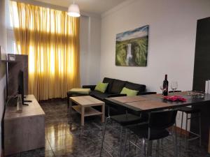 a living room with a couch and a table at Amaba TENERIFE in La Guancha