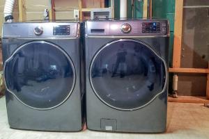 two washing machines are sitting next to each other at Fall Getaway Resort-3 KING suites, Dog-Friendly in Seeley