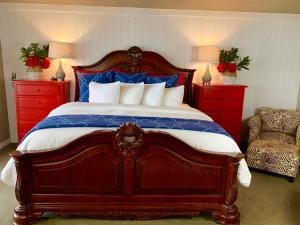 a bedroom with a large bed with blue and red furniture at Oceanhouse in Homer