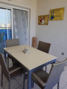 a dining room table with chairs and a turtle on it at HR PARADISE CALA DE LA VILA JOIOSA in Cala de Finestrat