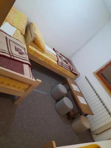 a room with two bunk beds with white balls on the floor at Jahorinska planinska kuća in Jahorina