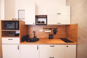 Η κουζίνα ή μικρή κουζίνα στο Central Square Apartment