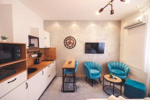 Μια τηλεόραση ή/και κέντρο ψυχαγωγίας στο Central Square Apartment