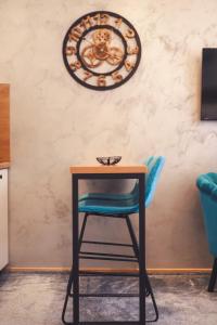 Μια τηλεόραση ή/και κέντρο ψυχαγωγίας στο Central Square Apartment +25 φωτογραφίες