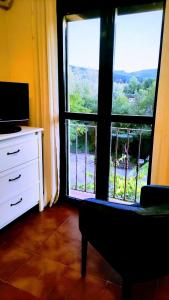 TV a/nebo společenská místnost v ubytování Hotel Ronda Valley