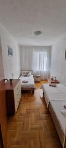 Postel nebo postele na pokoji v ubytování Apartments Ćosic