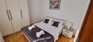 Posteľ alebo postele v izbe v ubytovaní Apartments Ćosic