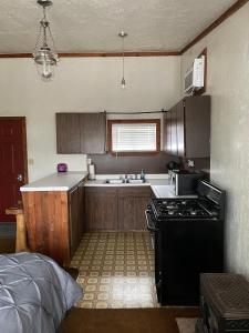 a kitchen with a stove and a sink at Adventures Vacation Rentals in Lava Hot Springs +17 photos
