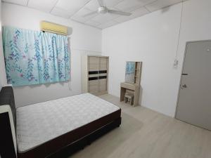 Postel nebo postele na pokoji v ubytování GP Hostel Penang