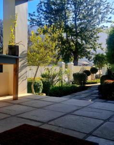 a stone walkway in front of a building at Bergview Guesthouse Swellendam in Swellendam