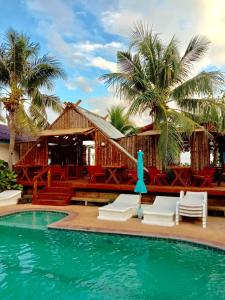 a resort with a swimming pool and palm trees at Lamai chalet in Amphoe Koksamui