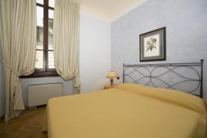 Posteľ alebo postele v izbe v ubytovaní Palazzo Gamba Apartments al Duomo