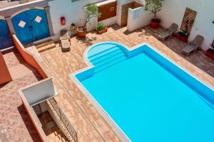 an overhead view of a swimming pool in a house at Apartments with swimming pool in Santa Teresa di Gallura in Santa Teresa Gallura