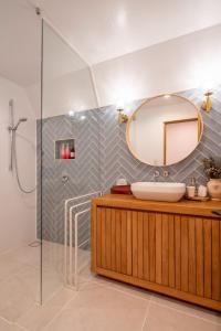 a bathroom with a sink and a mirror at A-Frame House Minami Karuizawa - Vacation STAY 58046v in Karuizawa