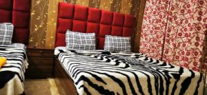 Ένα ή περισσότερα κρεβάτια σε δωμάτιο στο Karachi Guest House +20 φωτογραφίες