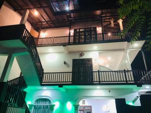 a building with a spiral staircase in a building at Hiru Resort Inn Unawatuna in Unawatuna