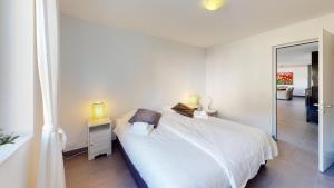 Postel nebo postele na pokoji v ubytování Family Apartment Sot Lantsch-Lenzerheide for 6 persons