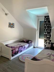 Postel nebo postele na pokoji v ubytování PALMandre (Pag Apartment Luxurious)