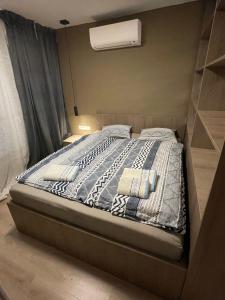 Ein Bett oder Betten in einem Zimmer der Unterkunft Apartmány Luxor Zemplínska Šírava