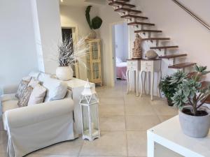 Posezení v ubytování Triana Procurador con Terraza Privada + 30 fotografií