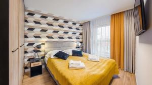 Posteľ alebo postele v izbe v ubytovaní Apartament z 2 sypialniami Elegant Lux 18 E Perłowa Przystań - Holiday City