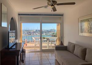 a living room with a couch and a balcony at La Bocayna Vistas 3 Islas in Corralejo