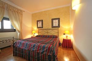 Posteľ alebo postele v izbe v ubytovaní Palazzo Gamba Apartments al Duomo