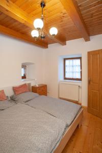 Postel nebo postele na pokoji v ubytování Apartmány NaVyhlídce