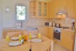a kitchen with a table with two chairs and a table sidx sidx sidx at Belvedere, LaVanta, Kalkan in Kalkan +13 photos