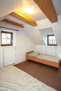 Postel nebo postele na pokoji v ubytování Apartmány NaVyhlídce + 26 fotografií