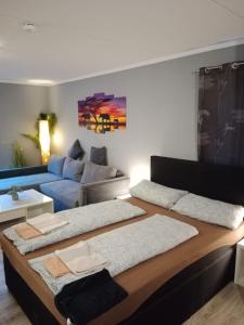 a living room with a couch and a table at Stadtnah an der Förde 144 in Flensburg