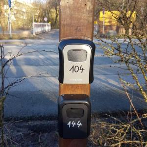 a parking meter on a pole on a street at Stadtnah an der Förde 144 in Flensburg