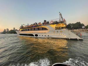 a boat with people on it in the water at نادى يخت الجيزة in Cairo