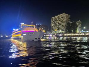 a large boat in the water at night at نادى يخت الجيزة in Cairo
