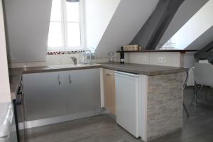 Kuchyňa alebo kuchynka v ubytovaní Appartement dans Résidence ( parc thermal Argeles Gazost)