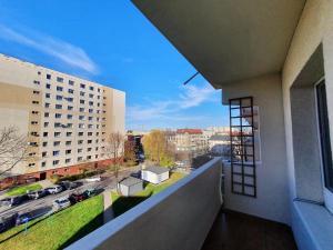 a balcony of a building with a view of a street at Happy Stay in Gliwice