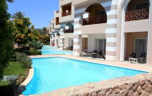 The swimming pool at or close to Rehana Royal Beach Resort - Aquapark & Spa - Family & Couples Only - Premium Ultra All-Inclusive 24H