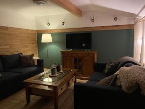 a living room with a couch and a coffee table at Ferienwohnung Kaiserin in Reit im Winkl