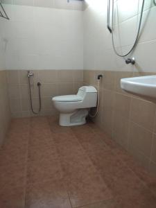 a bathroom with a toilet and a sink at Homestay Kemaman Private Pool Fyna in Kemaman