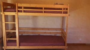 a couple of bunk beds in a room at Le Chalet de Poche - Gite 2 étoiles - 5 pers in Habère-Poche