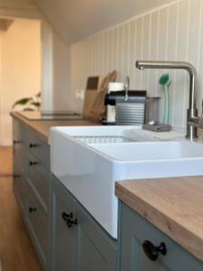 a kitchen with a sink and a counter top at TURM.blick in Goslar