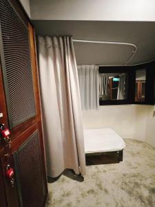 Postel nebo postele na pokoji v ubytování 拉開門輕旅 Le Passage Hostel