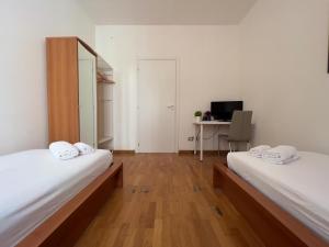 Łóżko lub łóżka w pokoju w obiekcie B&B Civico 40